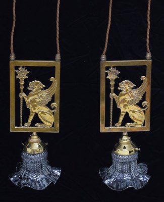 Lot 687 - Pair of heraldic brass library shades