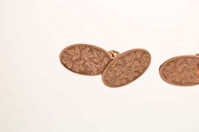 Lot 88 - Pair of 9ct gold foliate engraved oval cufflinks