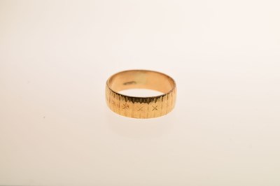 Lot 28 - 18ct gold textured wedding band