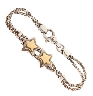 Lot 73 - Tiffany & Co-style white and yellow metal double rope and star link bracelet