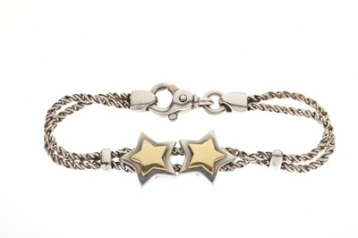 Lot 73 - Tiffany & Co-style white and yellow metal double rope and star link bracelet