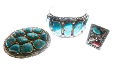 Lot 101 - Heavy white metal bangle set irregular turquoise cabochons