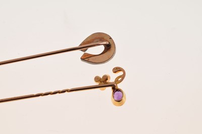Lot 65 - A stone set horseshoe stick pin