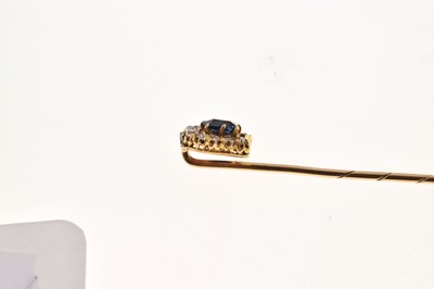 Lot 56 - A sapphire and diamond horseshoe stick pin