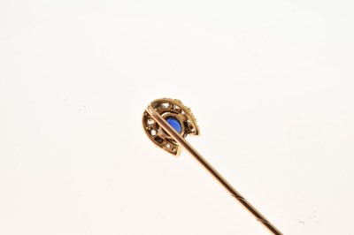Lot 56 - A sapphire and diamond horseshoe stick pin