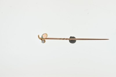 Lot 57 - An opal and diamond set stick pin