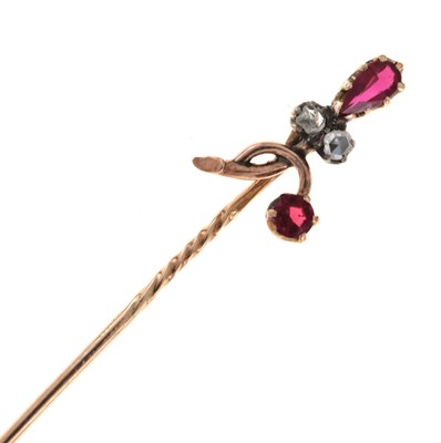 Lot 59 - A rose diamond and red paste set stick pin