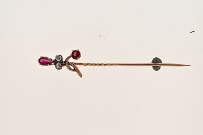 Lot 59 - A rose diamond and red paste set stick pin