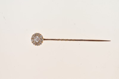 Lot 63 - A diamond cluster stick pin