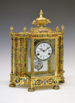 Lot 354 - Reproduction French style brass and enamel  four glass clock