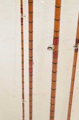 Lot 236 - Eight split cane and other fishing rods to include