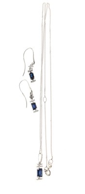 Lot 44 - 9ct white gold step cut sapphire and diamond pendant and earrings