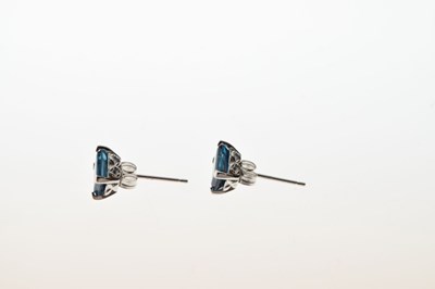 Lot 50 - 9ct white gold step cut blue topaz pendant and earrings set
