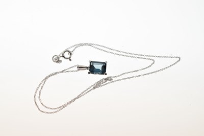 Lot 50 - 9ct white gold step cut blue topaz pendant and earrings set