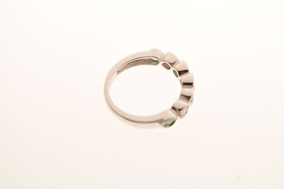 Lot 18 - 9ct white gold, emerald and diamond half eternity ring