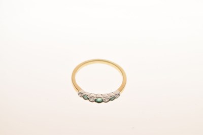 Lot 19 - 9ct gold, emerald and diamond half eternity ring