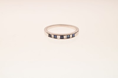 Lot 35 - 9ct white gold half hoop eternity ring, channel set square cut sapphires and baguette cut diamonds