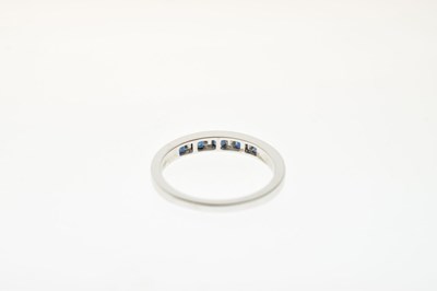 Lot 35 - 9ct white gold half hoop eternity ring, channel set square cut sapphires and baguette cut diamonds