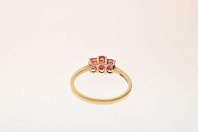 Lot 43 - 9ct gold three-stone ruby ring