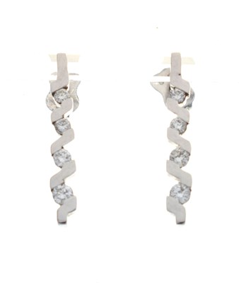 Lot 151 - Pair of 9ct white gold diamond set earrings