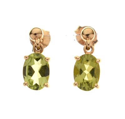 Lot 156 - Peridot and gold drop earrings