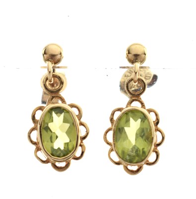 Lot 159 - Peridot  and yellow metal drop earrings