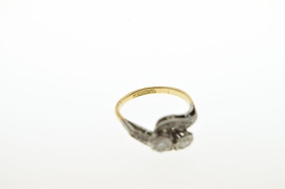 Lot 24 - Two-stone diamond crossover ring