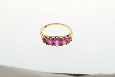 Lot 39 - Dress ring set five oval pink-sapphire coloured stones