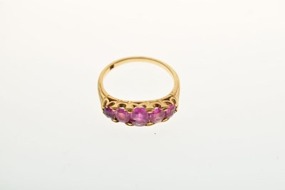 Lot 39 - Dress ring set five oval pink-sapphire coloured stones