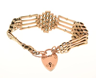 Lot 120 - A 9ct gold charm bracelet