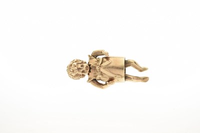 Lot 100 - 9ct gold articulated doll charm