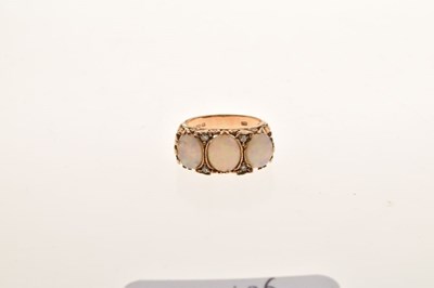 Lot 24 - 9ct gold three stone opal ring
