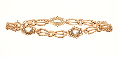 Lot 139 - 9ct gold bracelet set four pale blue stones