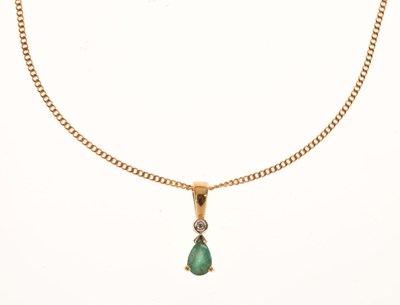 Lot 108 - 9ct gold pendant set a pear cut emerald and a small diamond