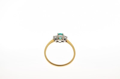 Lot 30 - 18ct gold, emerald and diamond three stone ring