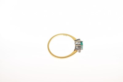 Lot 30 - 18ct gold, emerald and diamond three stone ring