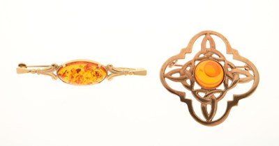 Lot 95 - 9ct gold Celtic-design brooch centrally set an amber-coloured stone