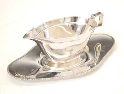 Lot 210 - George V silver Art Deco sauce boat and earlier tray