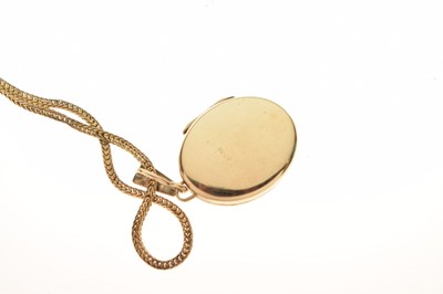 Lot 127 - Two 9ct gold lockets on chains