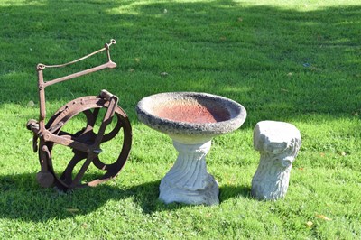 Lot 650 - Composite stone garden bird bath, together with an iron wheel