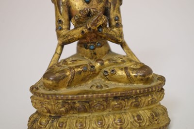 Lot 465 - Small and fine early Tibetan gilt bronze figure of a bodhisattva