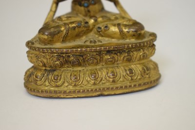 Lot 465 - Small and fine early Tibetan gilt bronze figure of a bodhisattva