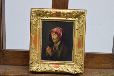 Lot 523 - After Rembrandt Harmensz. van Rijn, (1606-1669) - Oil on panel - Old woman praying