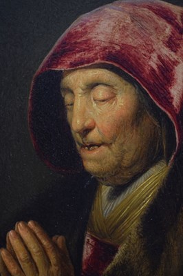 Lot 523 - After Rembrandt Harmensz. van Rijn, (1606-1669) - Oil on panel - Old woman praying