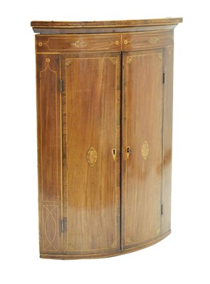 Lot 785 - George III inlaid mahogany bowfront corner cupboard