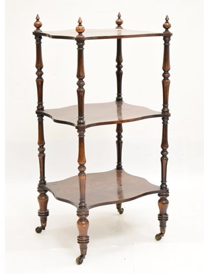 Lot 832 - Rosewood three-tier serpentine whatnot