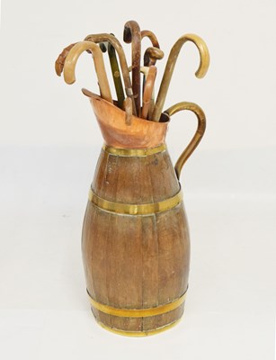 Lot 362 - Coopered barrel stick stand, together with a quantity of walking sticks and canes