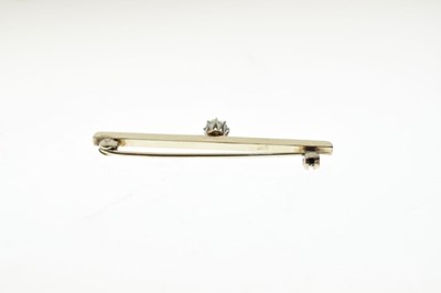Lot 32 - White metal bar brooch set single brilliant-cut diamond