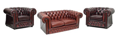 Lot 624 - Thomas Lloyd wine Chesterfield two seater sofa and two armchairs