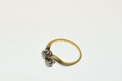 Lot 3 - Yellow metal and diamond crossover ring